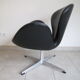 Swan armchairs in black leather by Arne Jacobsen for Fritz Hansen