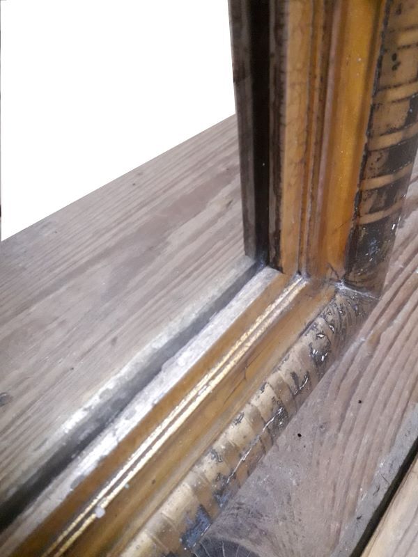 Golden Louis Philippe mirror H122xW84cm with gilded motifs.