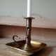 Antique metal and brass hand candle holder on rectangular base