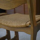 Set of 6 oak dining chairs with rush seat and 'Echelle' backrest in the style of Guillerme et Chambron 1950s