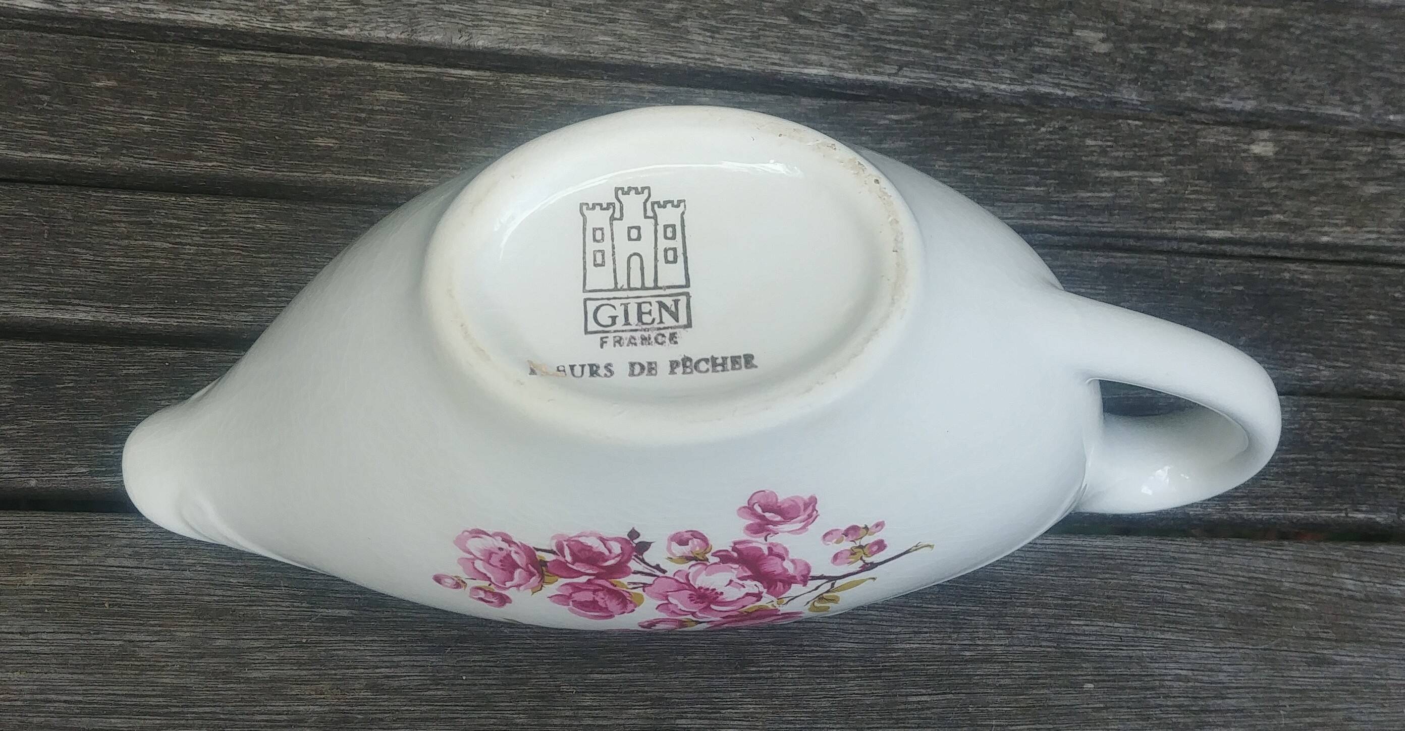 Porcelain saucière of the Gien earthenware factory model "peach blossoms"