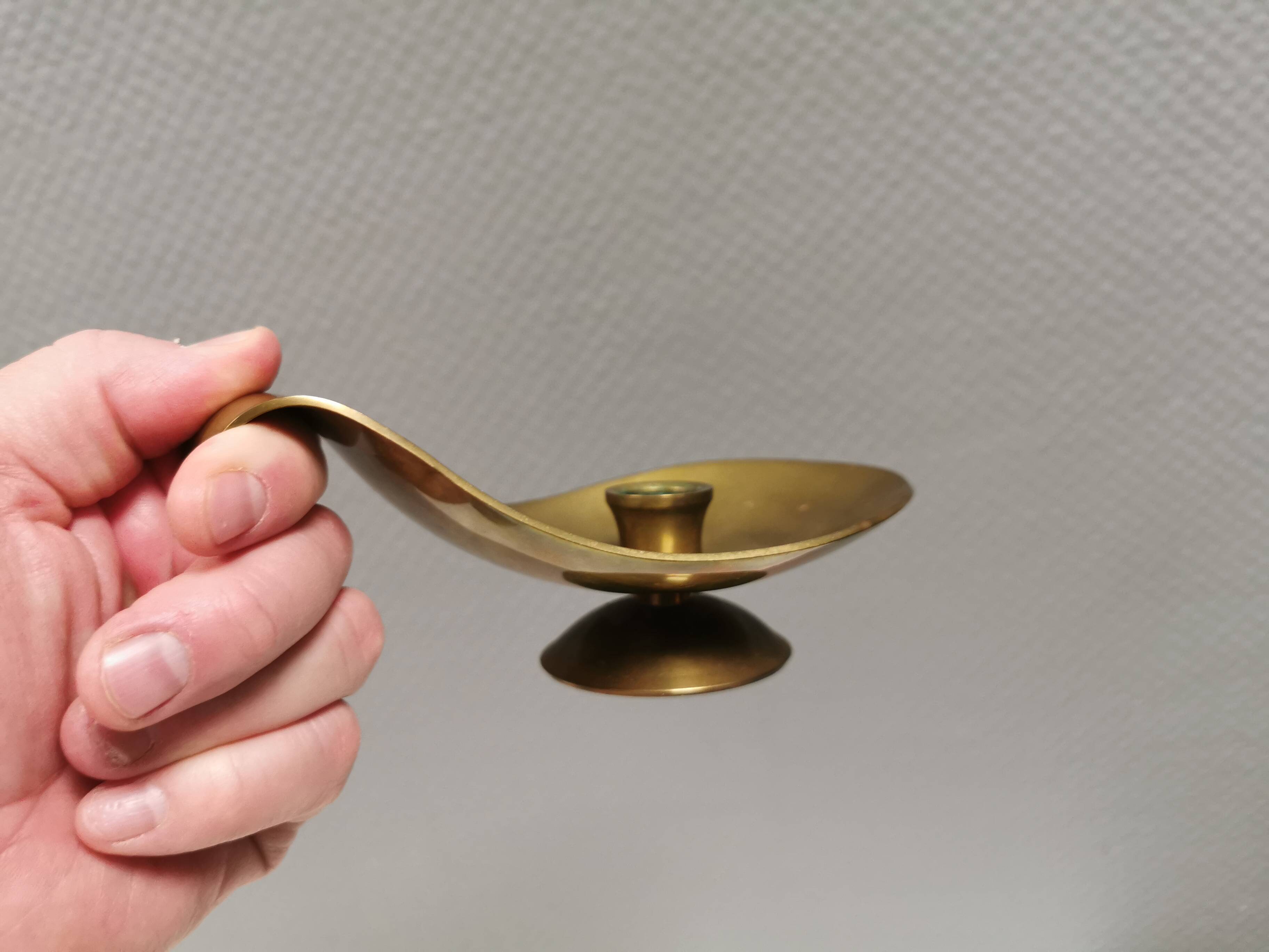 Brass candlestick for a single candle