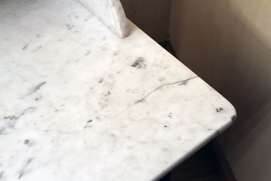 Vintage vanity toilet furniture with marble top.
