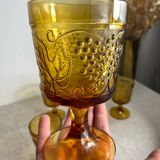 Six stemmed glasses in amber-colored molded glass