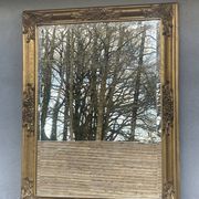 vintage bevelled mirror in rectangular shape, stucco and gilded wood in Louis XV baroque style