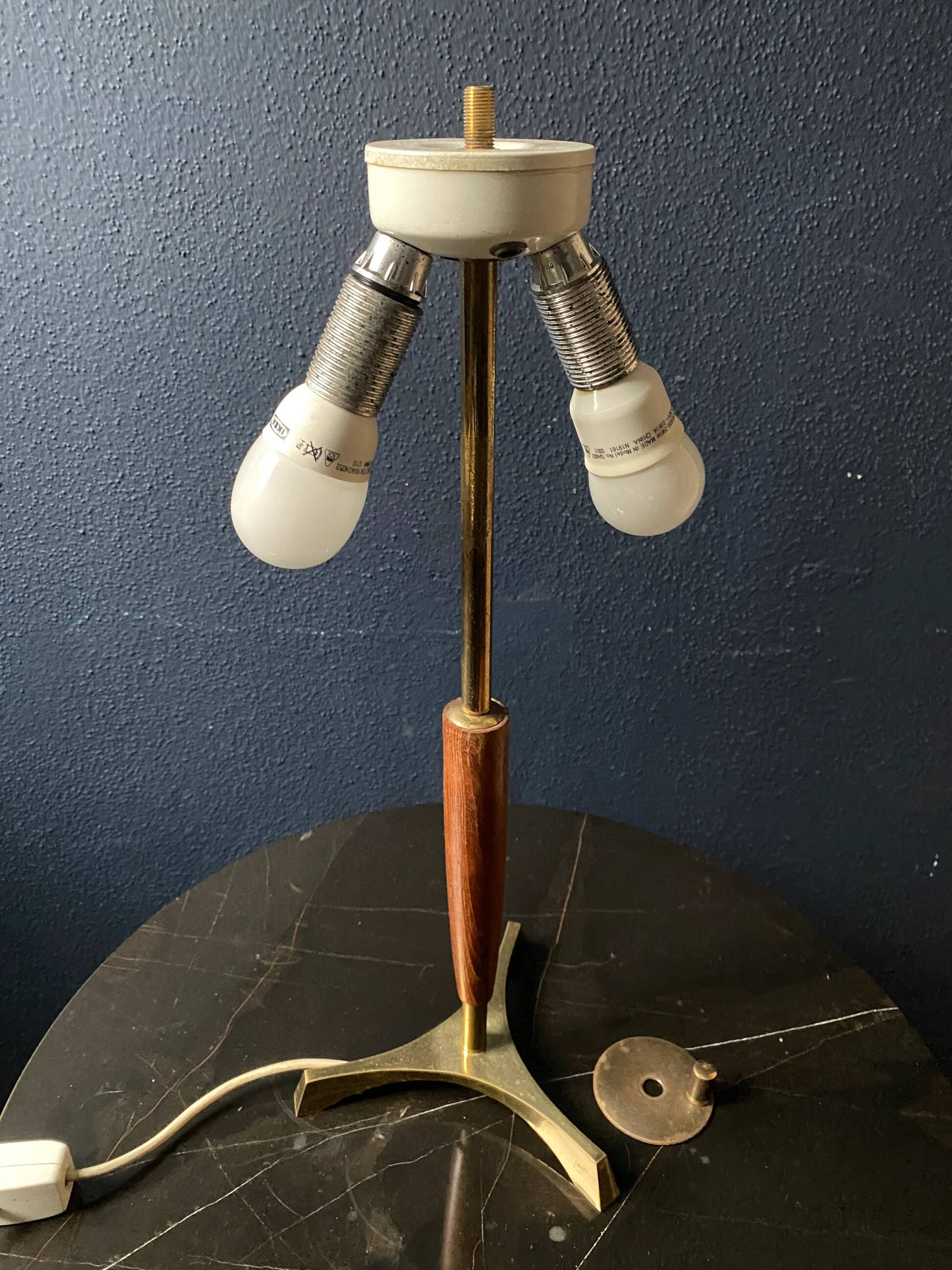 Elegant table lamp with a slender teak body on a tripod brass base, Germany, 1960s.