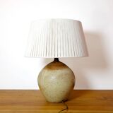 Large stone lamp with a cotton shade.