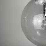 Large suspended lamp with a glass globe featuring bubbles by Peill & Putzler 1970.
