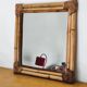 Woven bamboo mirror in natural tone