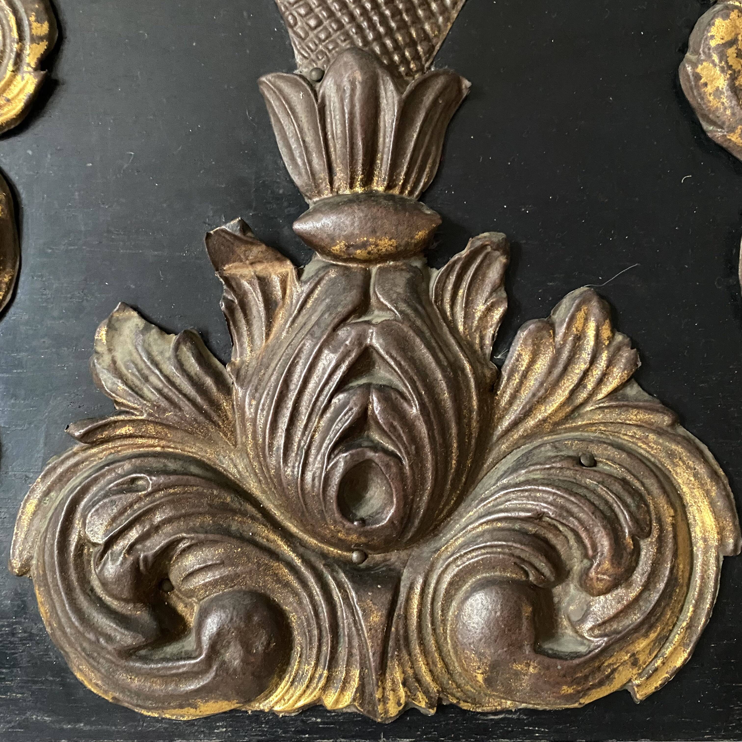 Pediment in blackened wood and 19th century embossed gilded metal foil