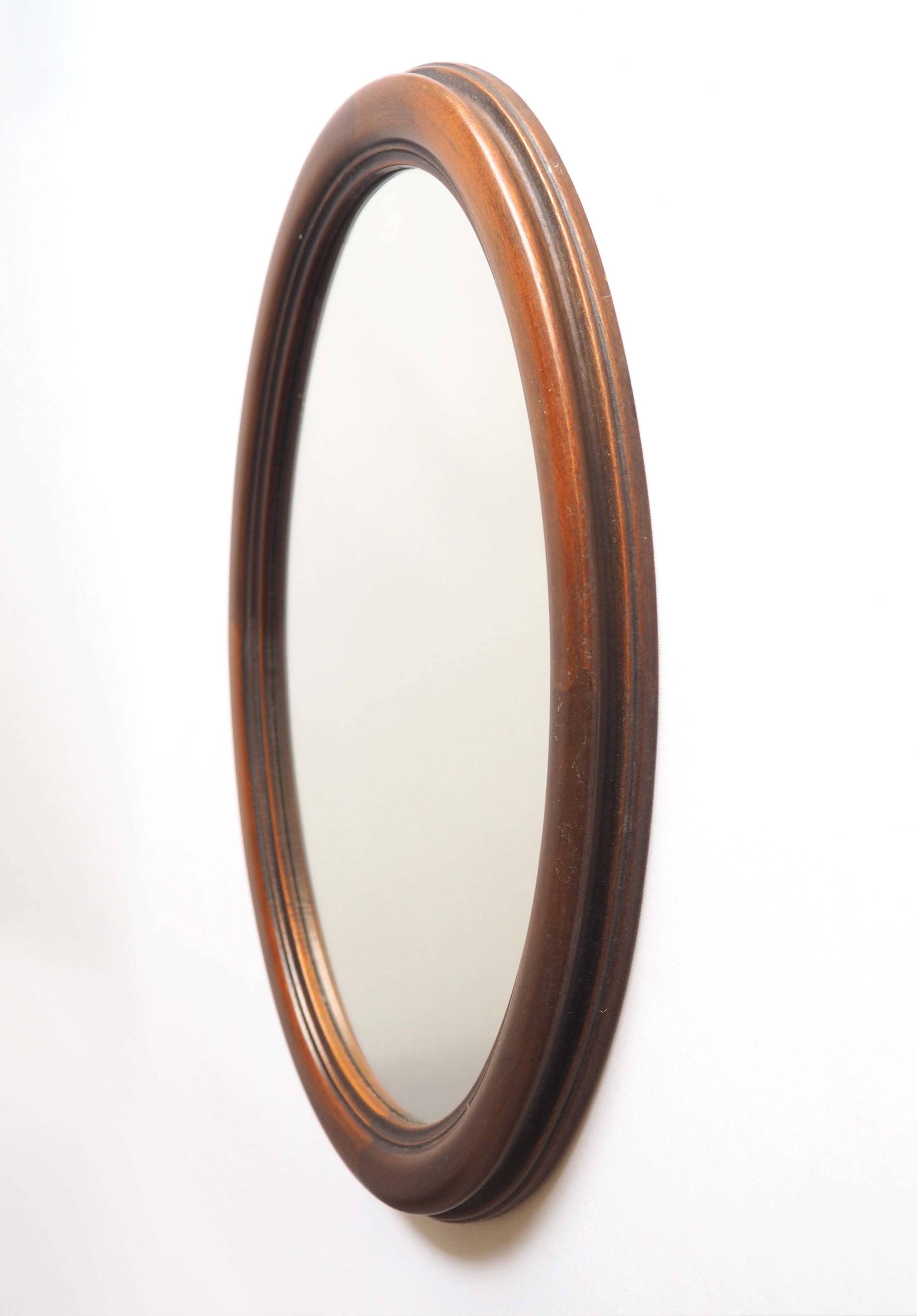 Oval mirror with wooden frame