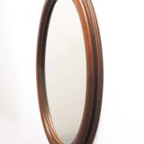 Oval mirror with wooden frame