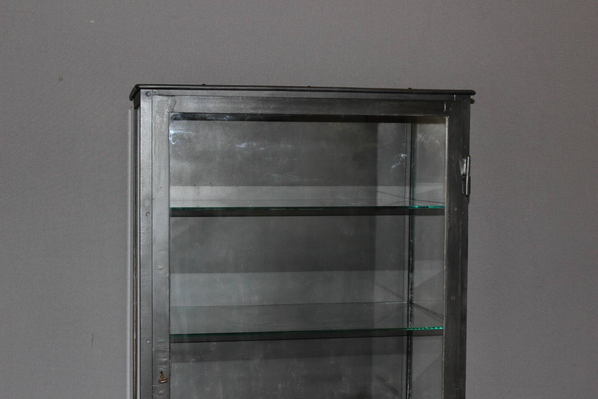 Iron display cabinet with black patina from around 1920