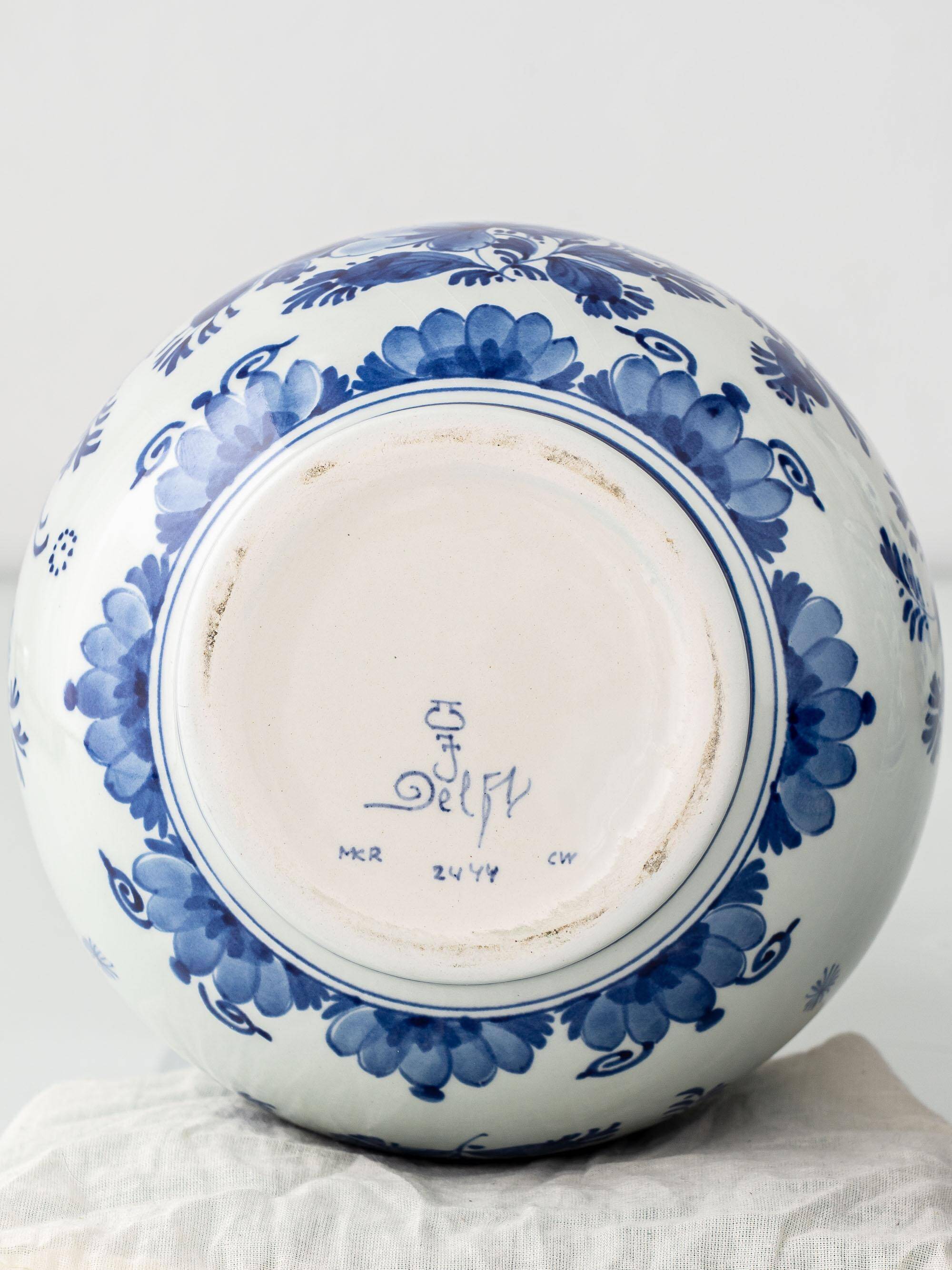 Pair of Royal Delft blue and white ceramic table lamps with new vermilion silk shades.