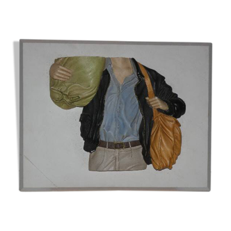 plaster relief painting representing young backpacker