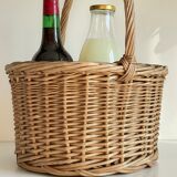 Basket with vintage rattan bottles
