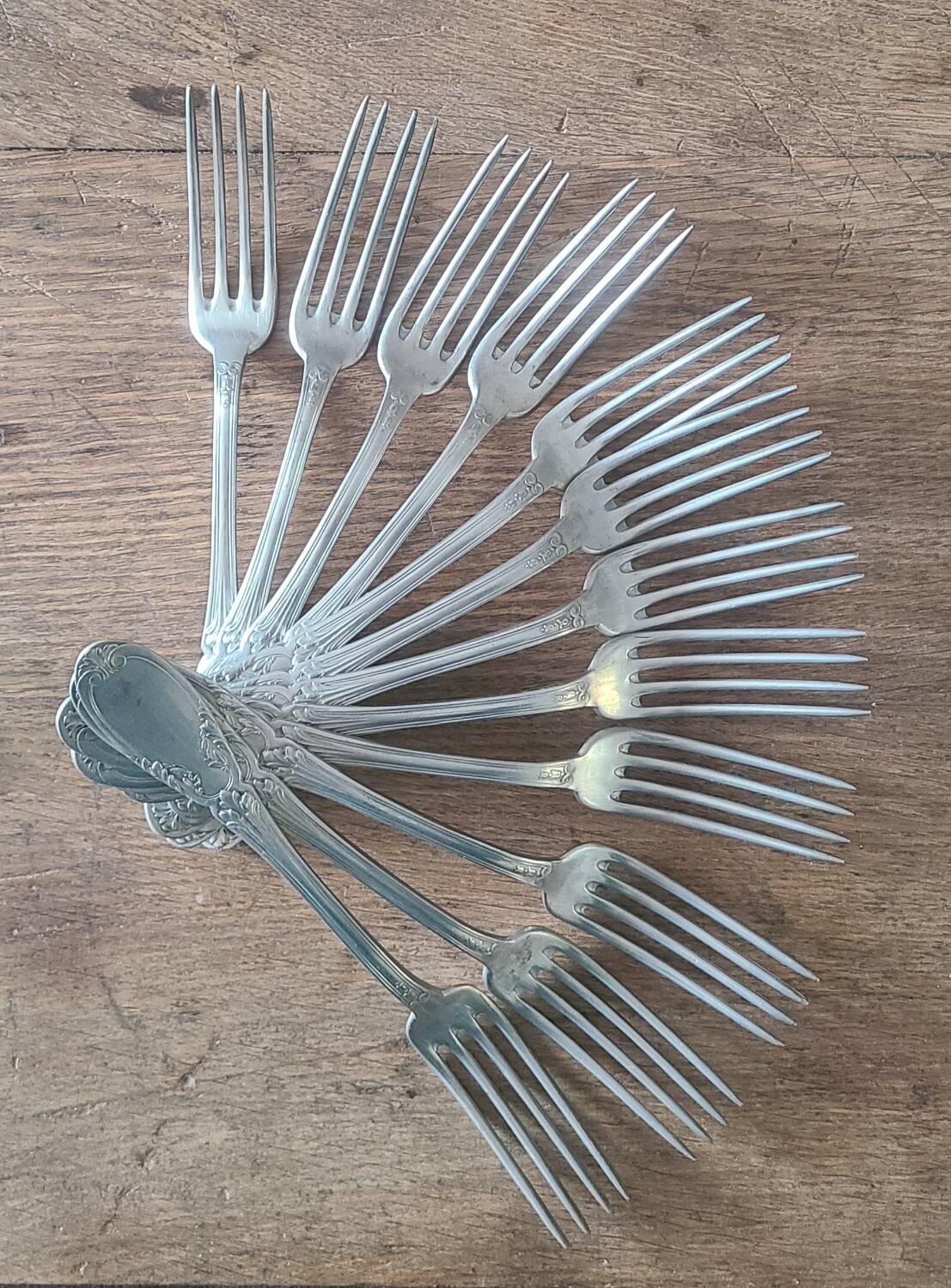 Set of 12 vintage silver-plated metal forks.