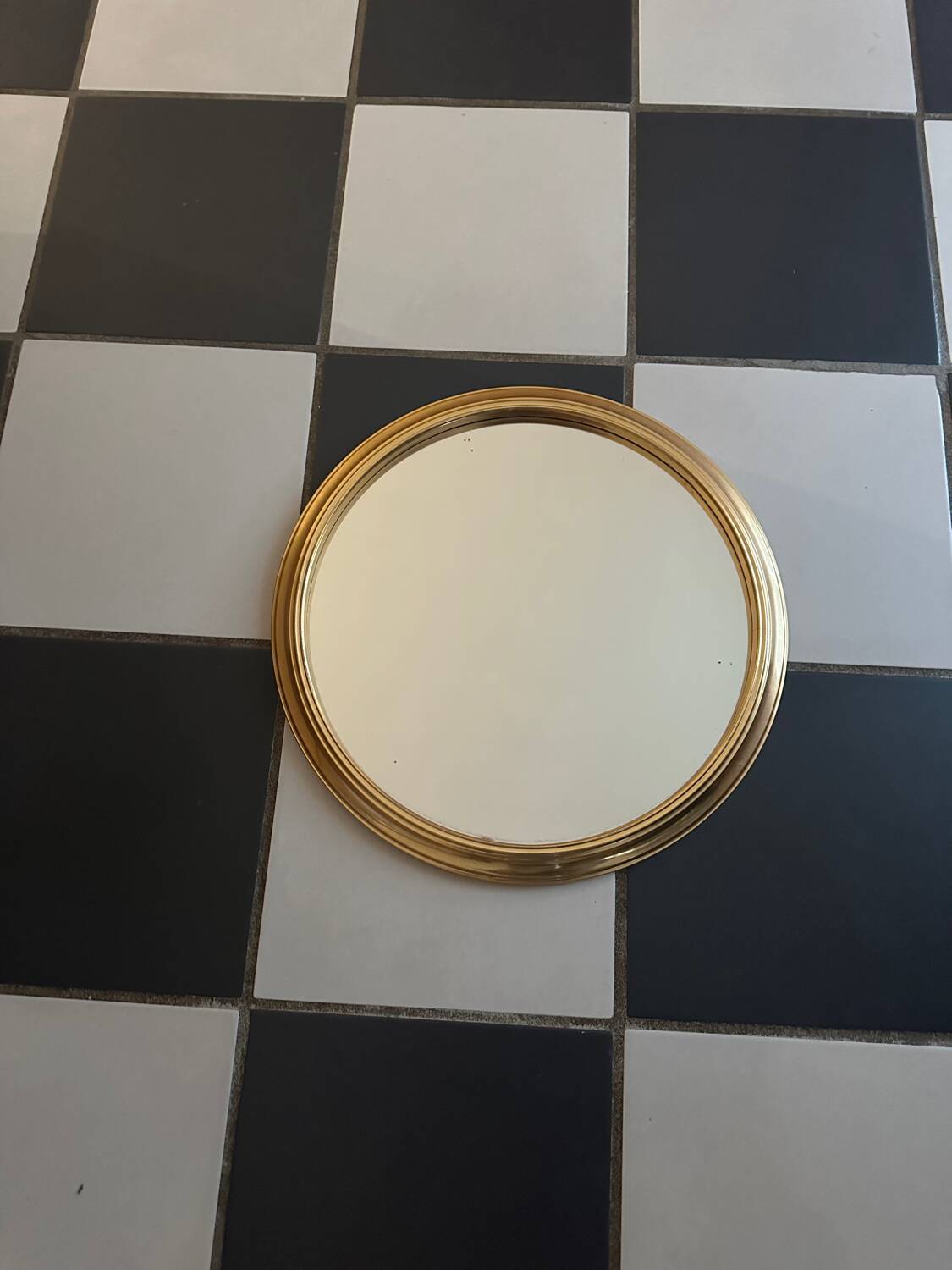 Round golden mirror