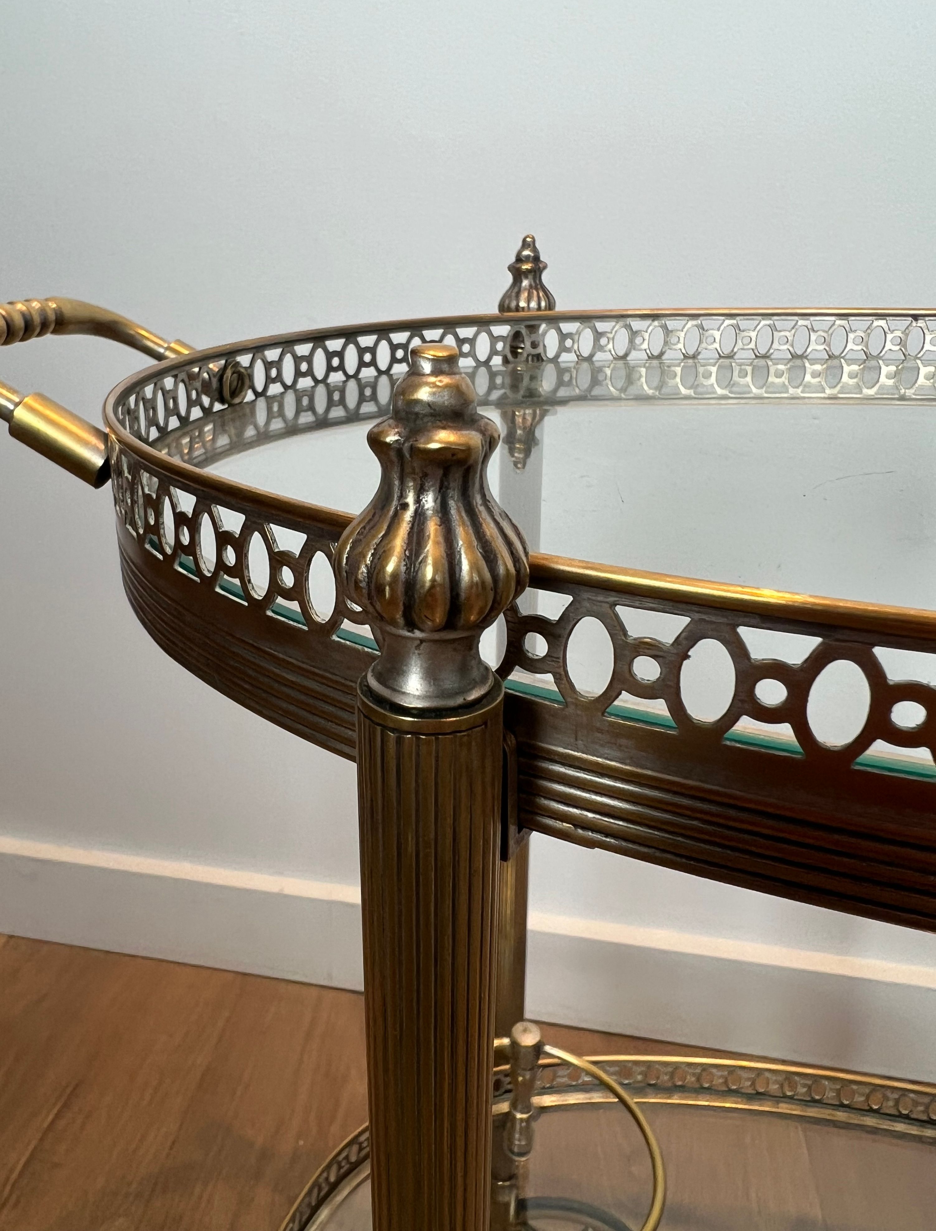 Small wheeled table in silvered brass from the Baguès house.