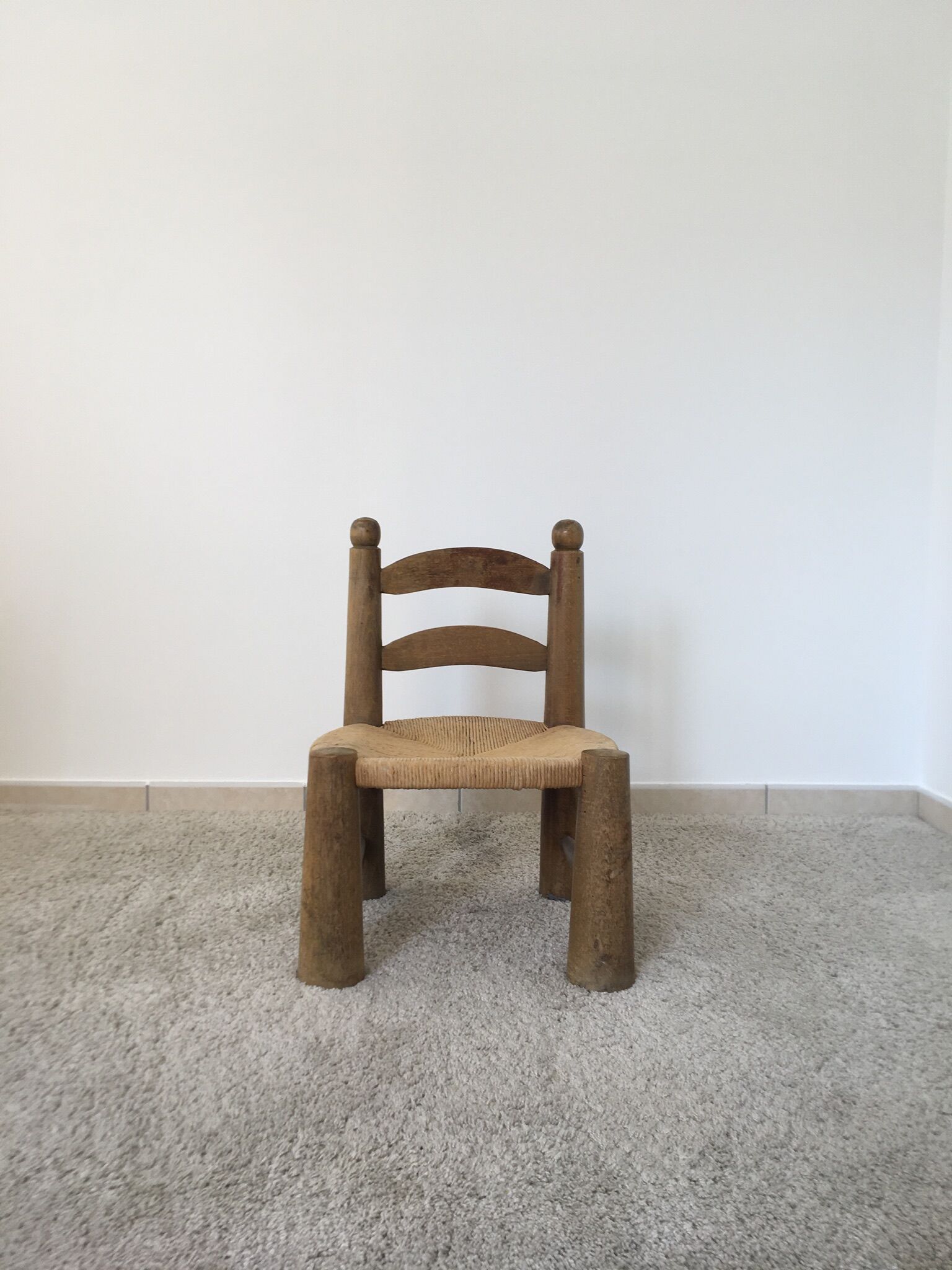 Low wooden chair and straw 50s
