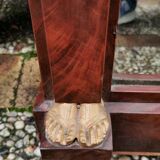 Mahogany pediment mirror with Empire-style cariatids. Return from Egypt