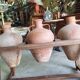 Old wooden jar holder with 3 clay jars