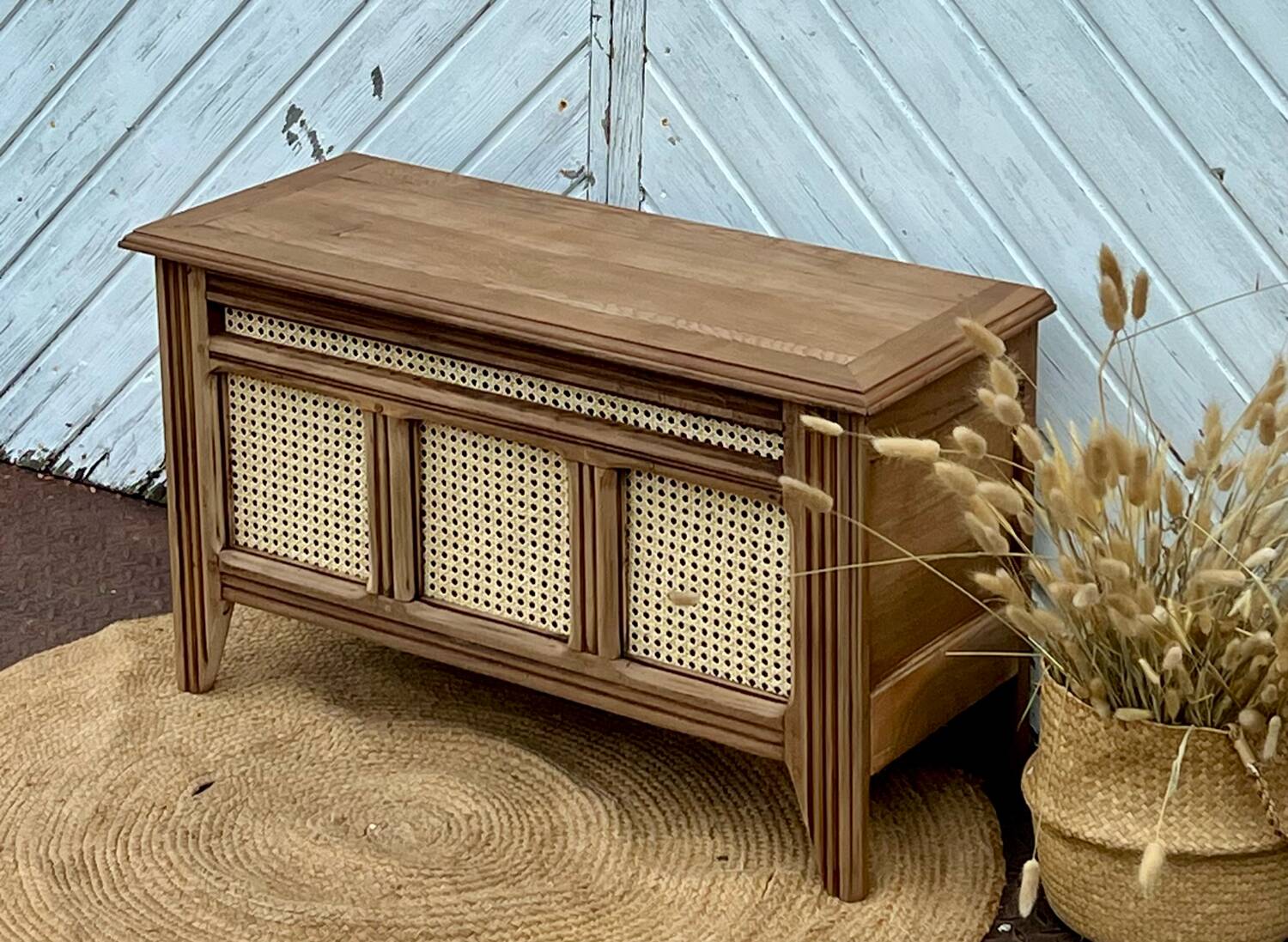 Antique oak chest with raw wood and cane work.