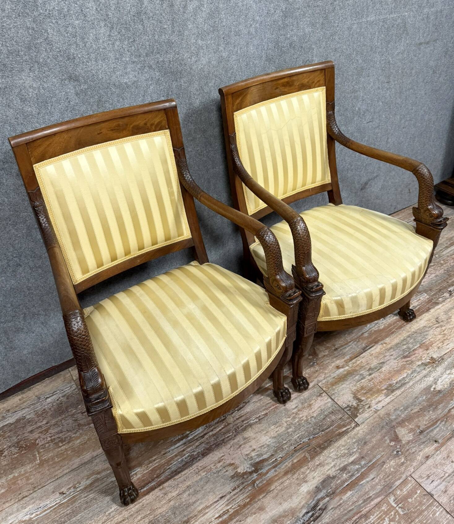 Pair of Empire period mahogany dolphin armchairs