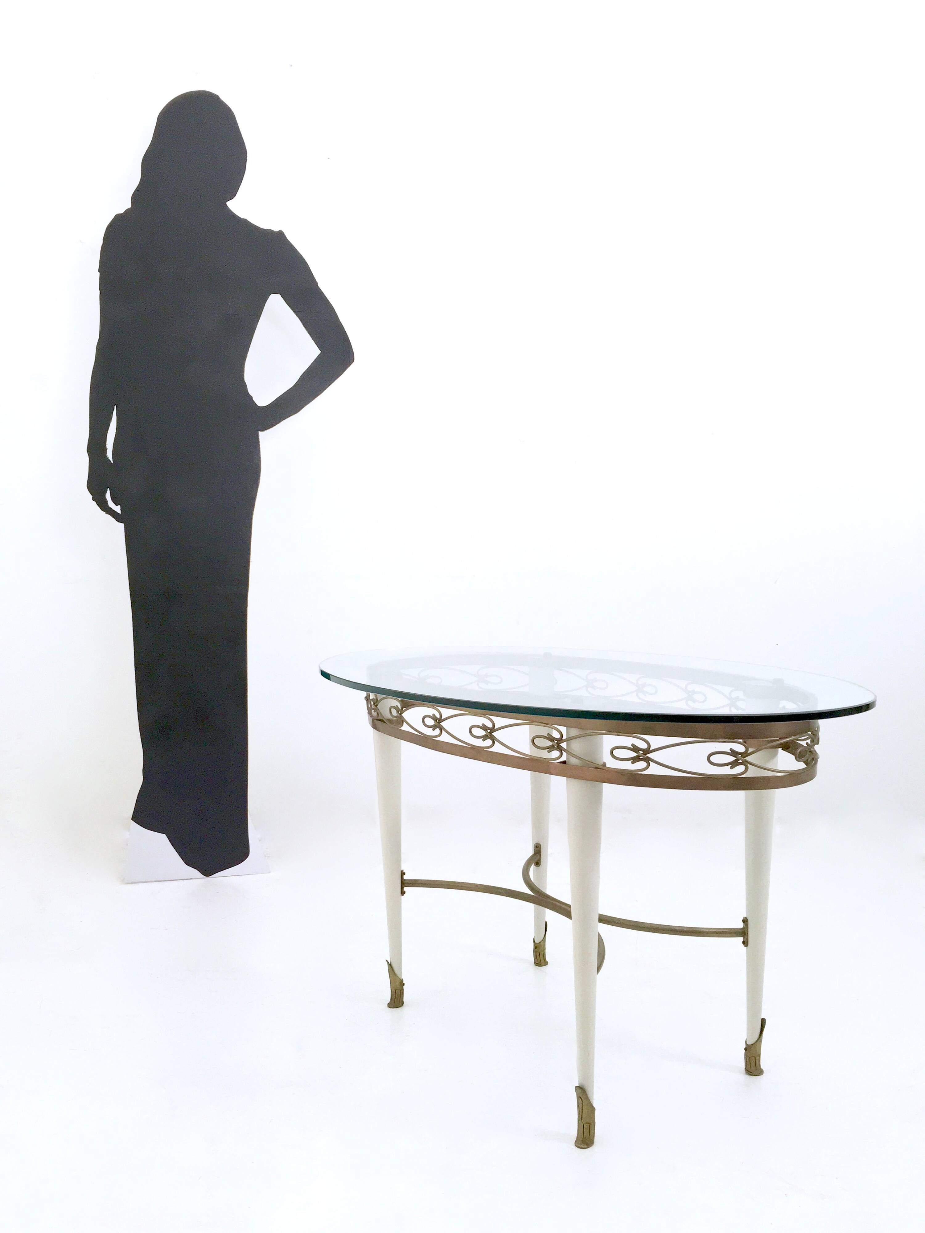 Brass Coffee Table with an Oval Glass Top in the Style of Pierluigi Colli