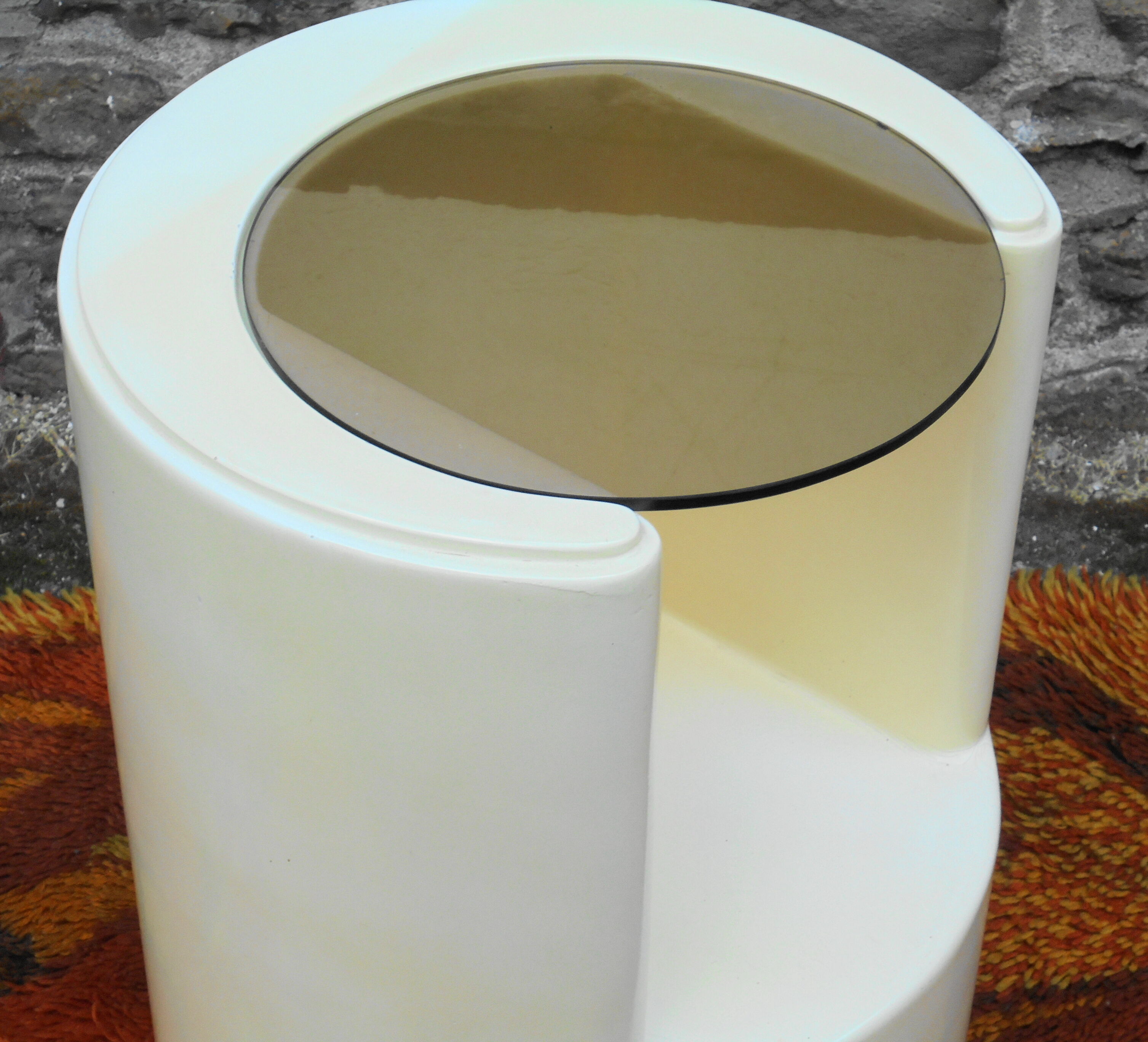 Cylindrical fiberglass bedside table from the 60s