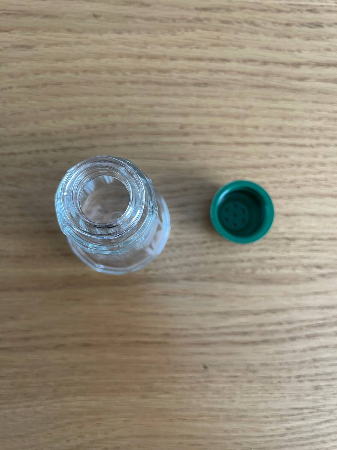 Vintage salt shaker with green Bakelite cap