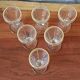 Antique footed liqueur glasses with gold trim from the early 20th century.