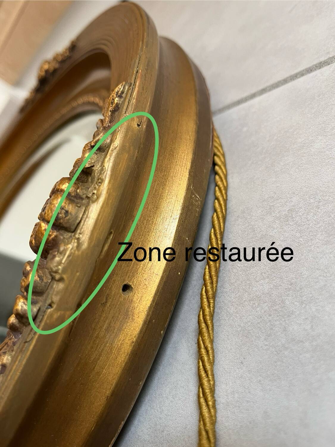 Oval gilt mirror and Art Deco trim