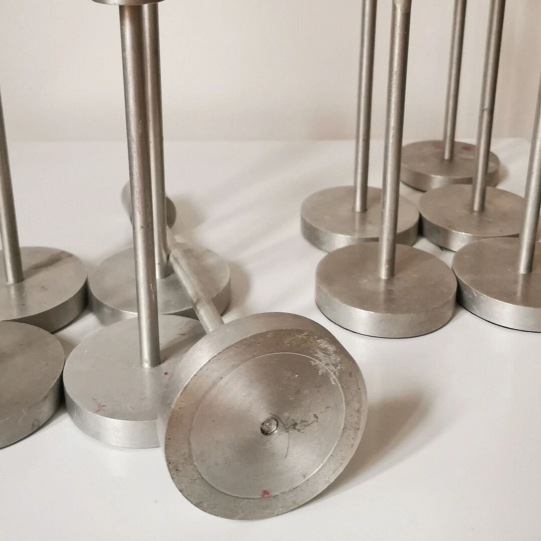 Set of 10 aluminium candle holders.