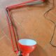Red articulated workshop lamp