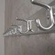 Wall-mounted aluminium coat rack of 225 cm with 16 double hooks, 1960s.