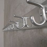 Wall-mounted aluminium coat rack of 225 cm with 16 double hooks, 1960s.