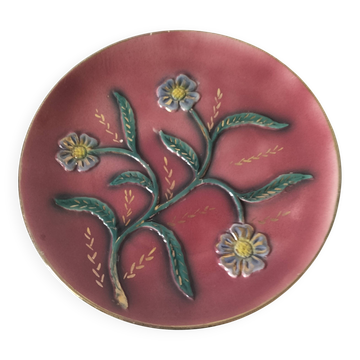 Large antique plate in floral slip with hand-painted relief decoration