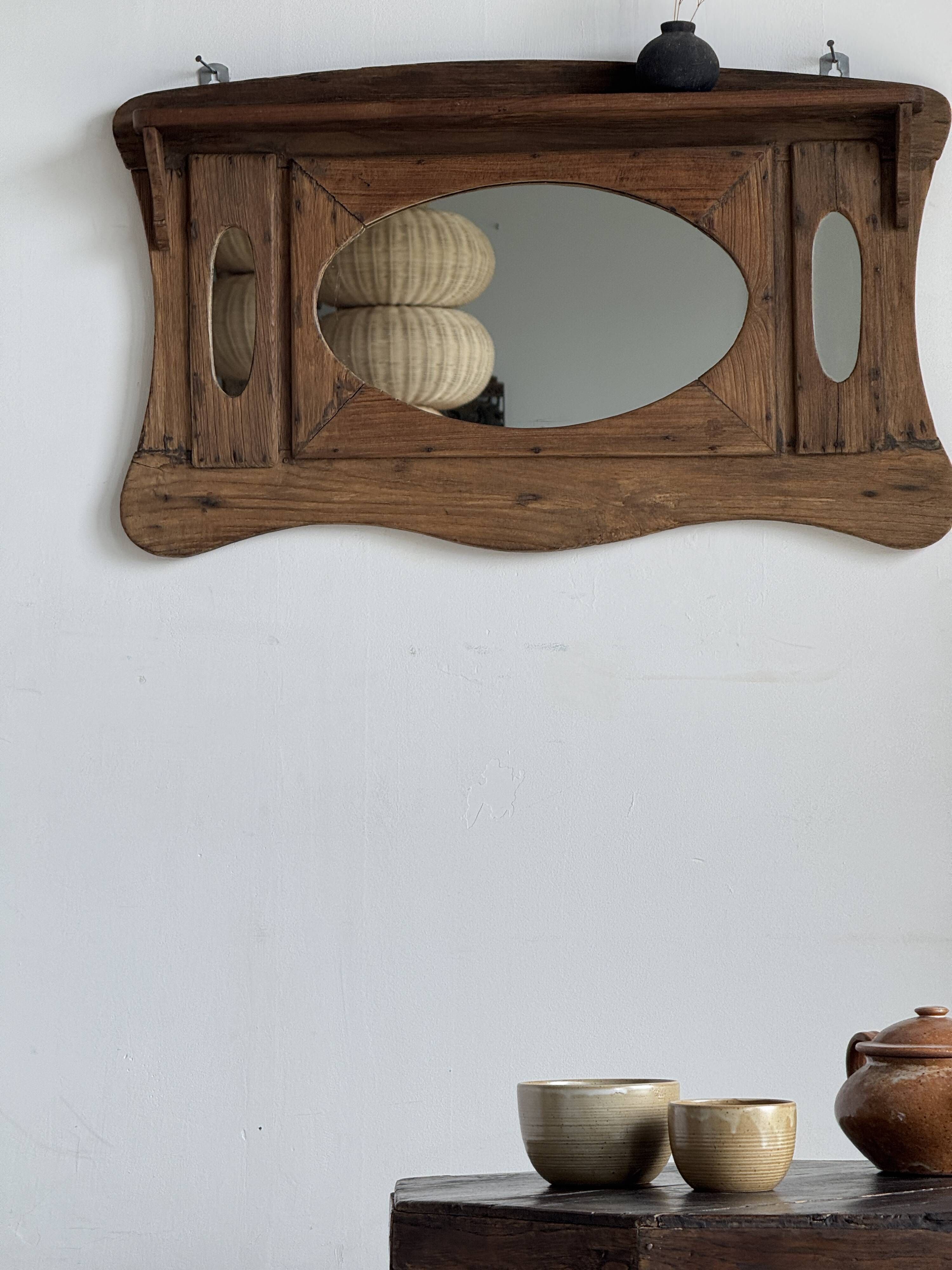 Small wall mirror in organic old Indonesian teak 75x45.
