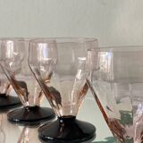 6 small Art Deco pink wine or water glasses with black stems.