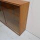 Vintage shop display cabinet with sliding doors