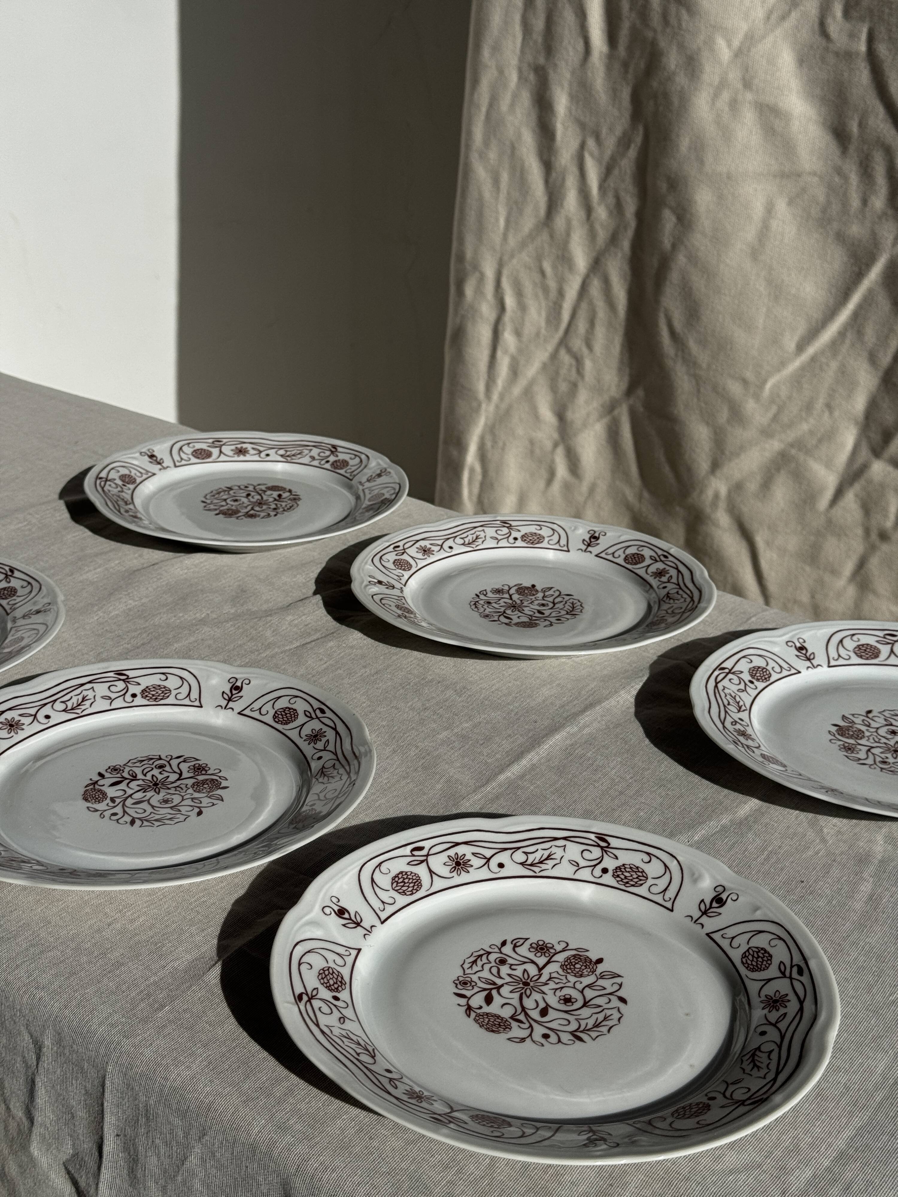Set of 6 vintage dessert plates made in Poland with a plant motif.