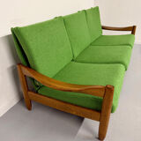Living room sofa and Scandinavian design armchairs from the 1960s in green boucle.