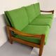 Living room sofa and Scandinavian design armchairs from the 1960s in green boucle.