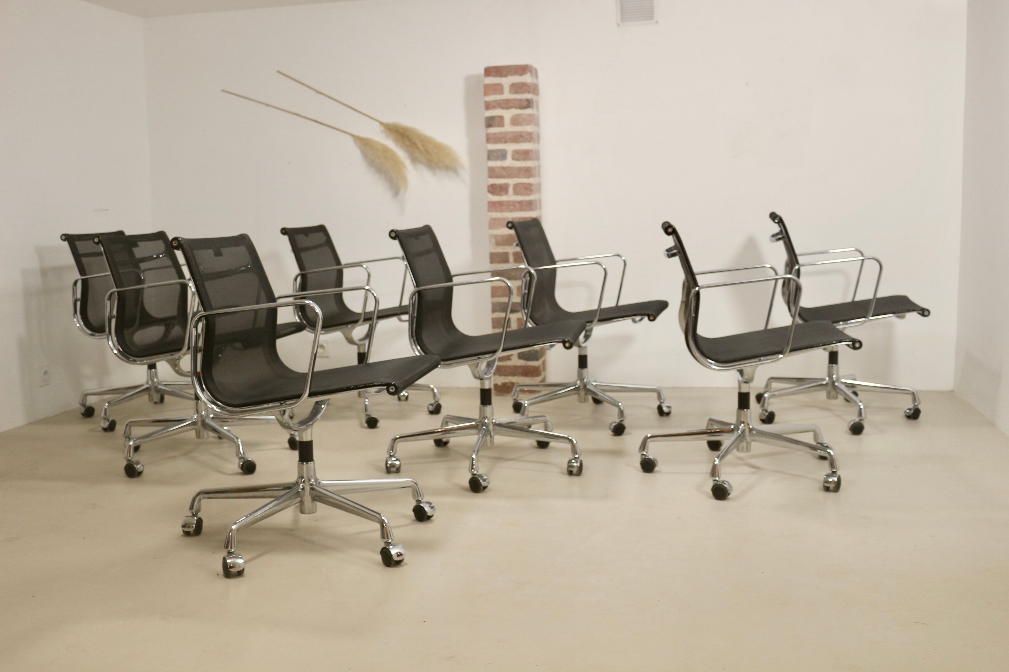 Set of 8 Charles and Ray Eames armchairs by Vitra model EA 117