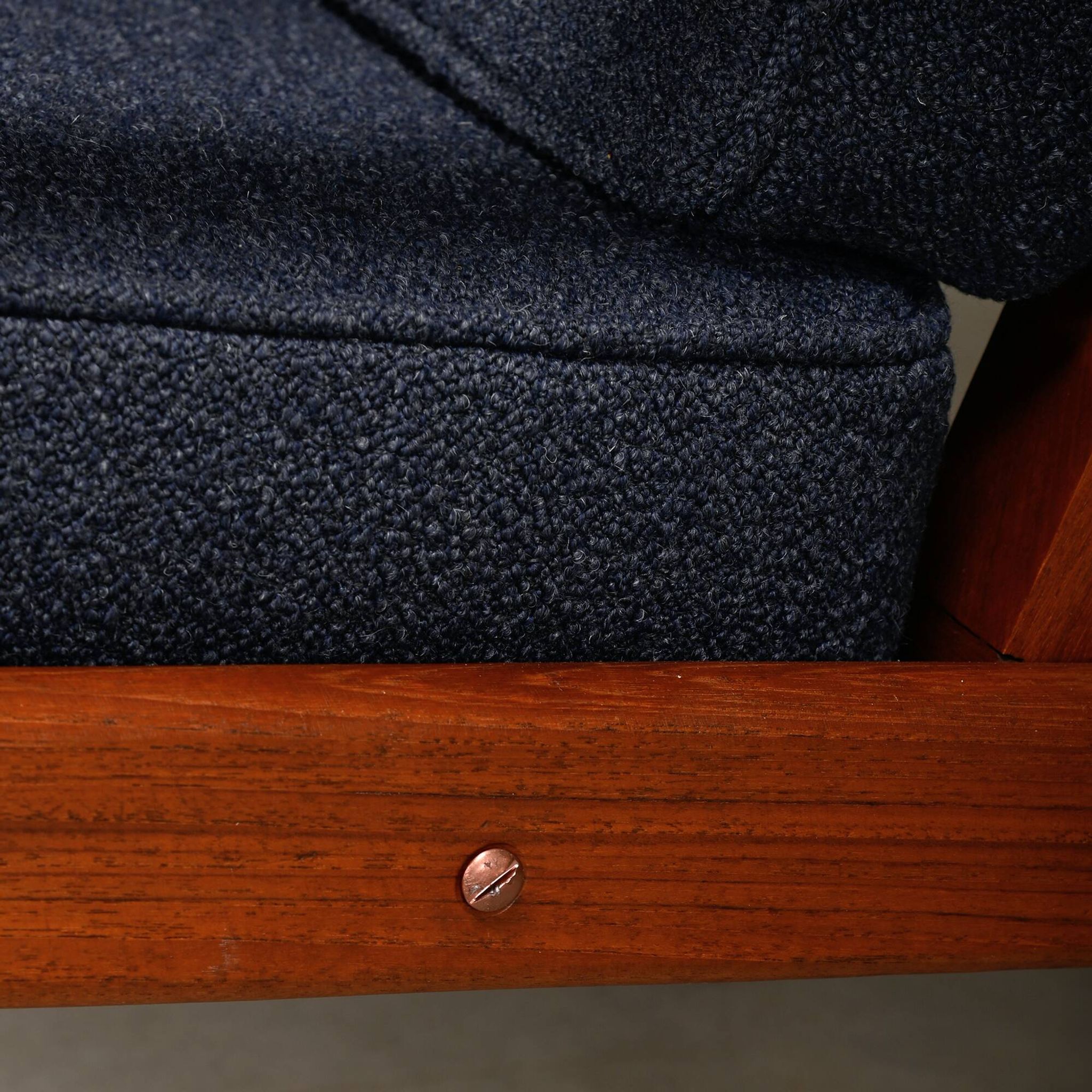 Pair Scandinavian Modern armchairs in teak and dark blue bouclé fabric