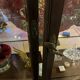 Dark-stained wood and glass vintage display cabinet — early 20th-century wall-mounted showcase
