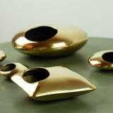 Set of pebble ashtrays in gilded bronze