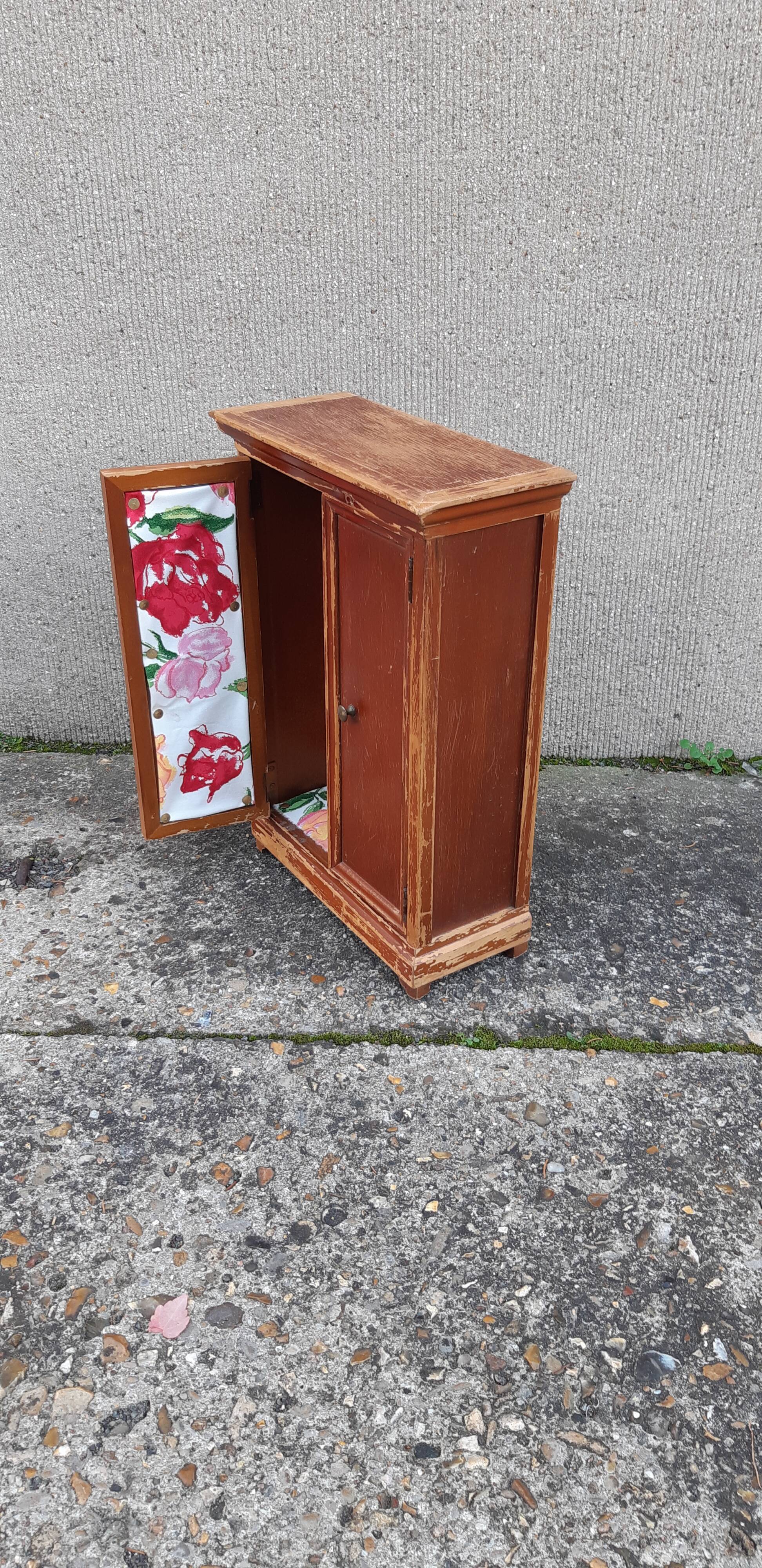 Wooden doll cabinet