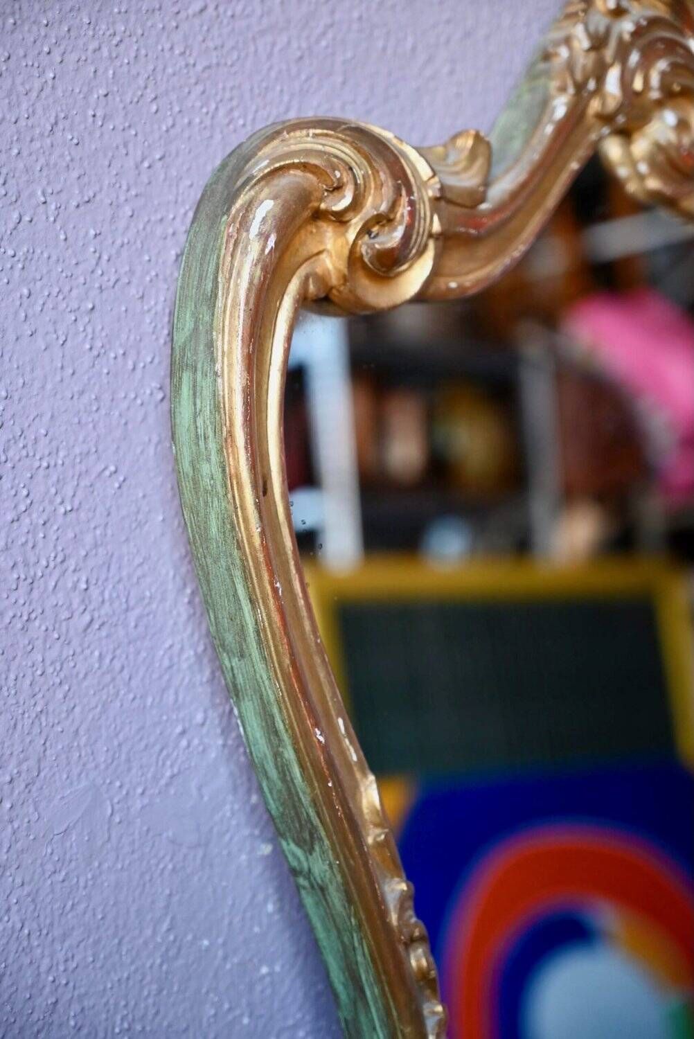 Baroque gold table mirror in Louis XV style, carved and stuccoed wood.